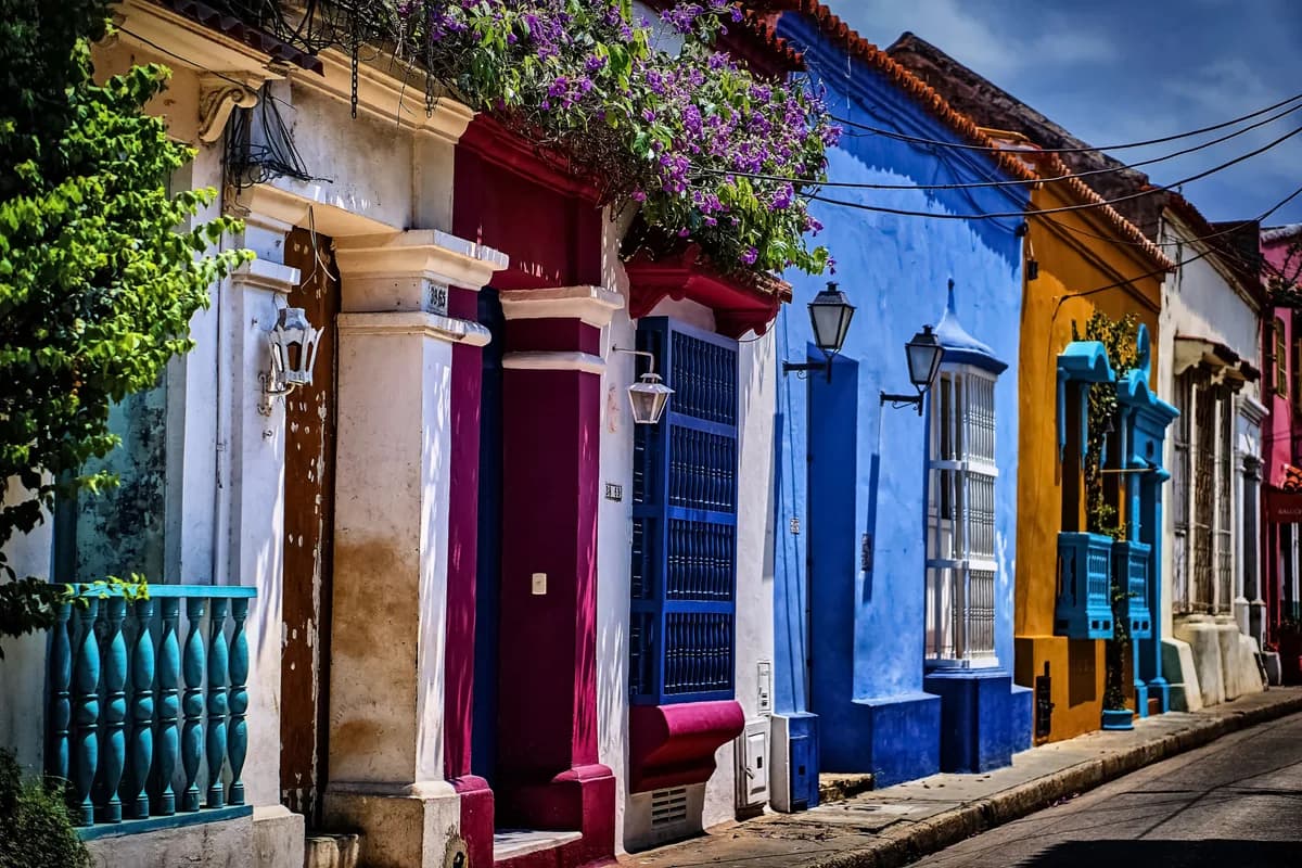Colorful colonial facades and flowering balconies on a street in Cartagena, Colombia