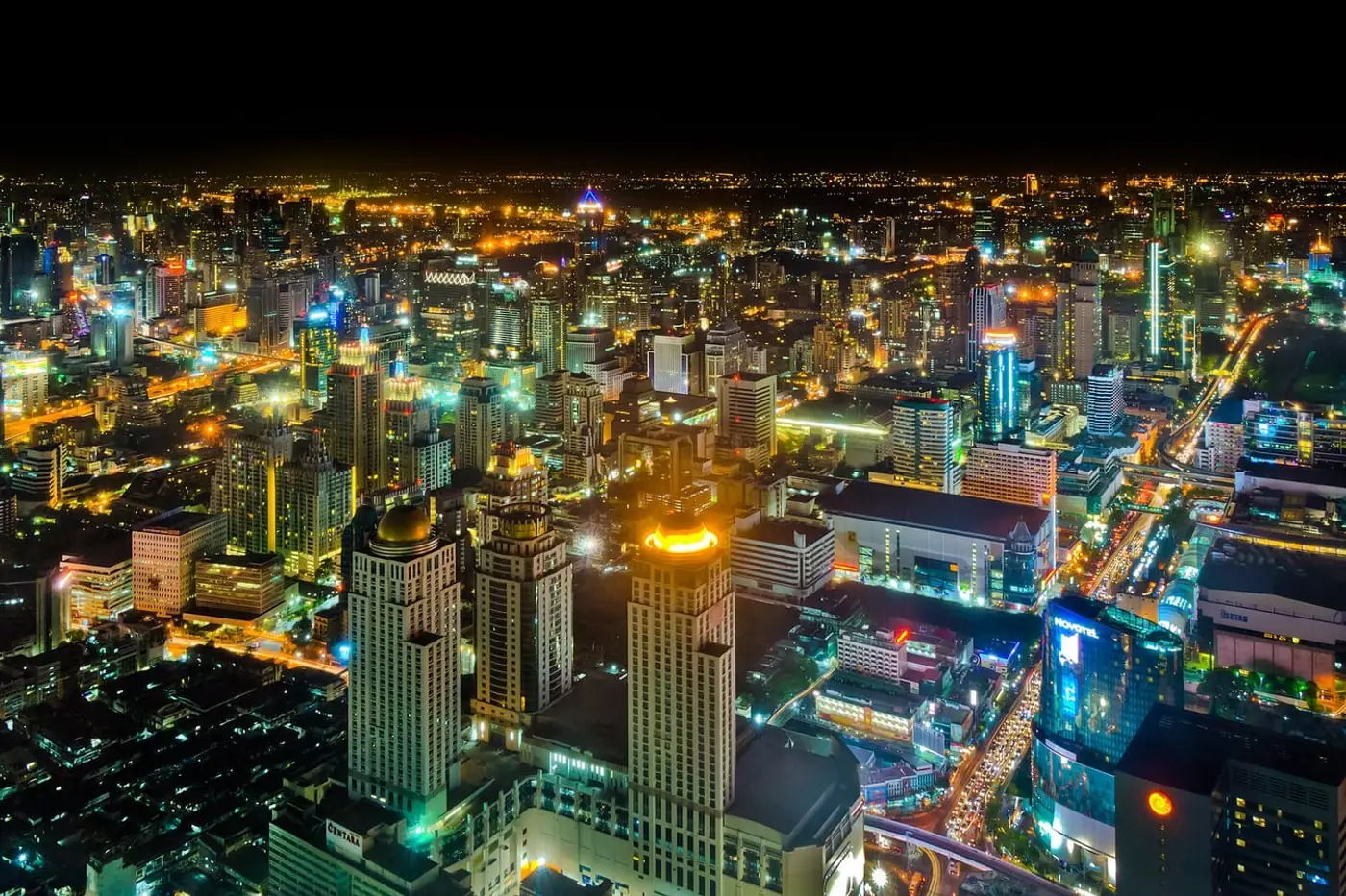Bangkok's towers and busy roads illuminated after dark