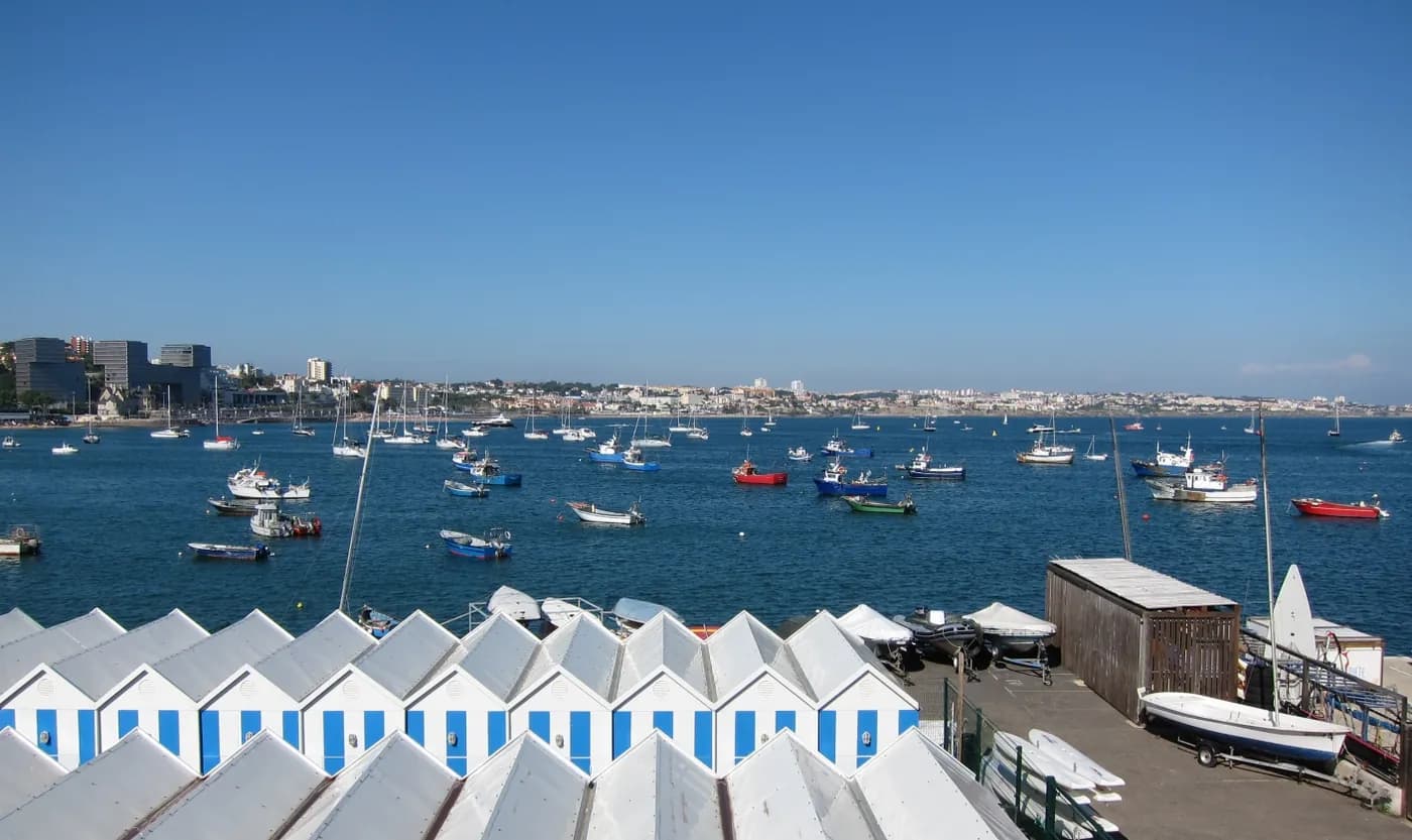 Boats in the blue waters of Cascais Bay beside the Portuguese town's waterfront