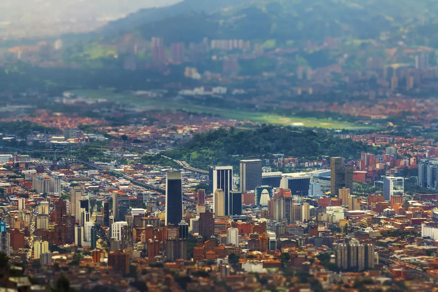 Medellín stretching across its mountain valley, seen from the hills above the city